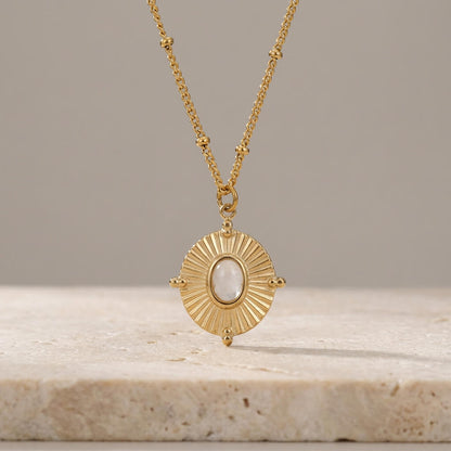 Collier médaillon rayonné doré