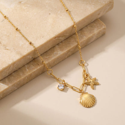 Collier charms marins dorés