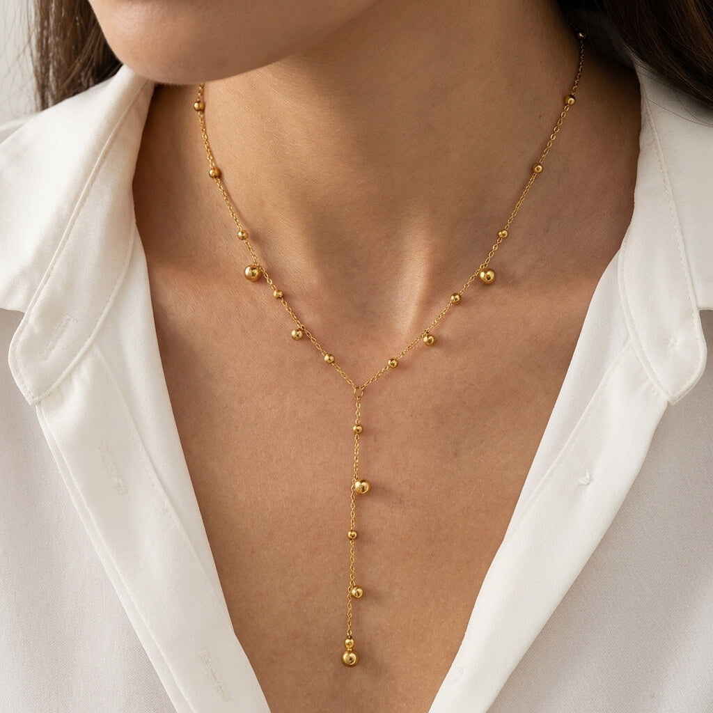 Collier sautoir Y plaqué or perles dorées